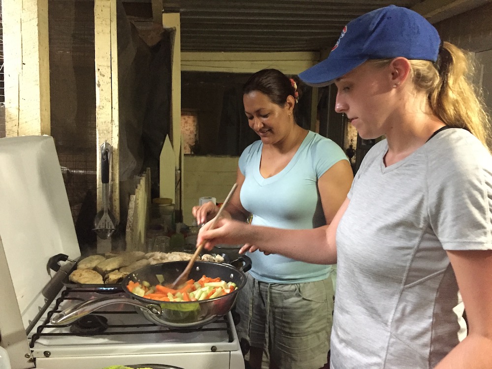 American teen cooking with a Honduran woman